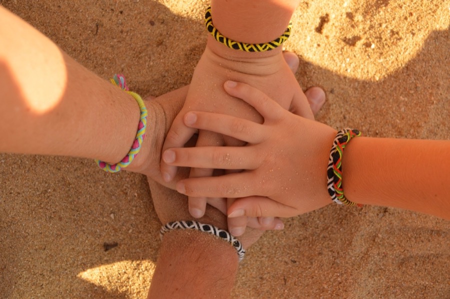 Hands joined together in support